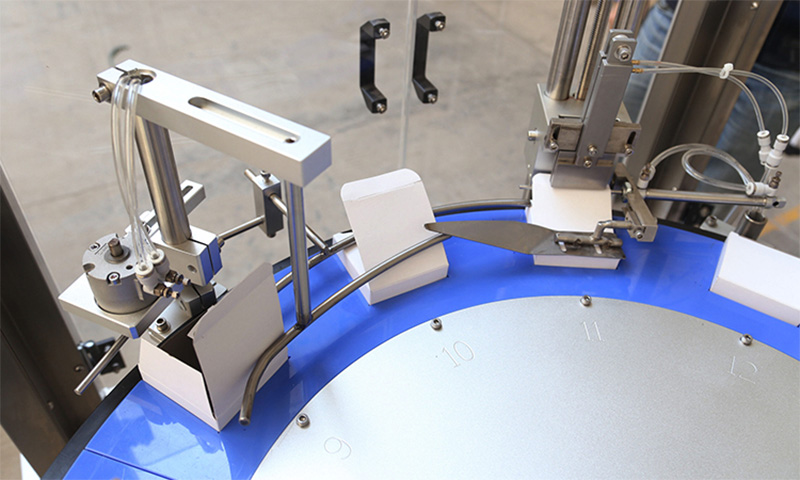 Cam Linkages Coordinate Carton Pre-Breaking and Smooth Product Insertion